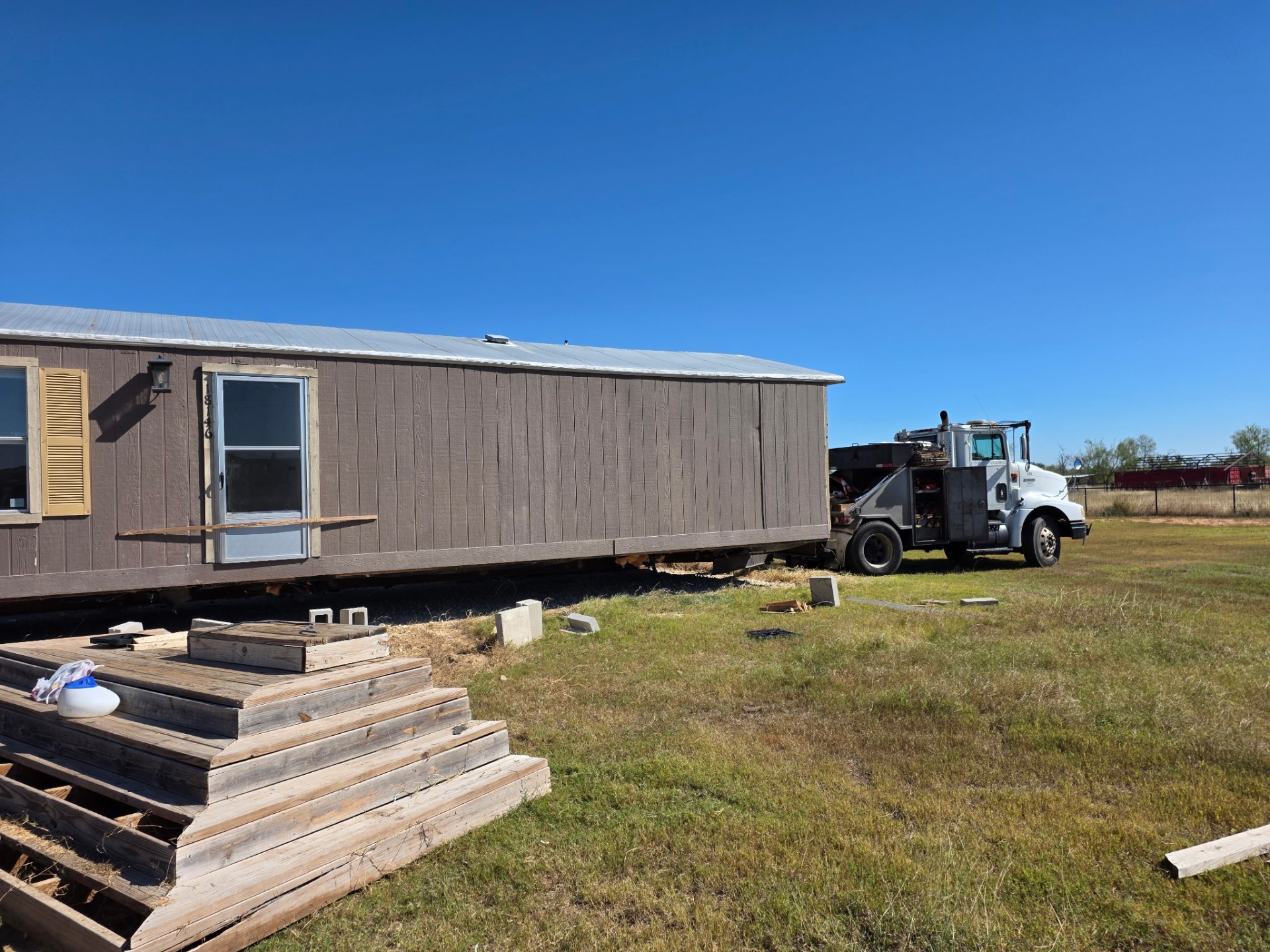 Manufactured home set in position at a new site