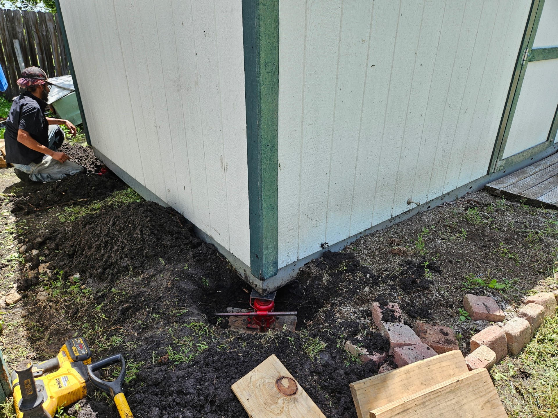 Support piers and jacks set beneath the home during leveling